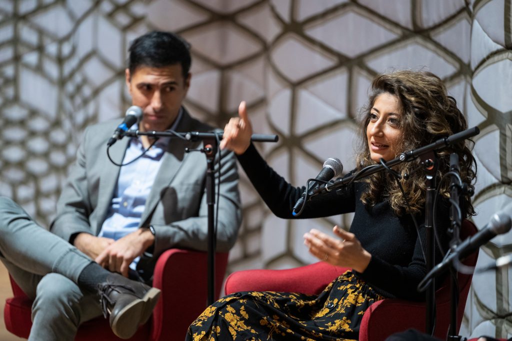Ramtin Arablouei (left) and Rund Abdelfatah, co-hosts and co-producers of NPR’s podcast “Throughline” and UW–Madison’s fall Journalists in Residence engage in a public panel discussion during a Diversity Forum event held at the Chazen Museum of Art at the University of Wisconsin–Madison on Nov. 14, 2022. Not pictured is panelist Kacie Lucchini Butcher and moderator Christy Clark-Pujara. The museum is currently hosting the the public exhibit: Sifting & Reckoning: UW–Madison’s History of Exclusion and Resistance. (Photo by Jeff Miller / UW-Madison)