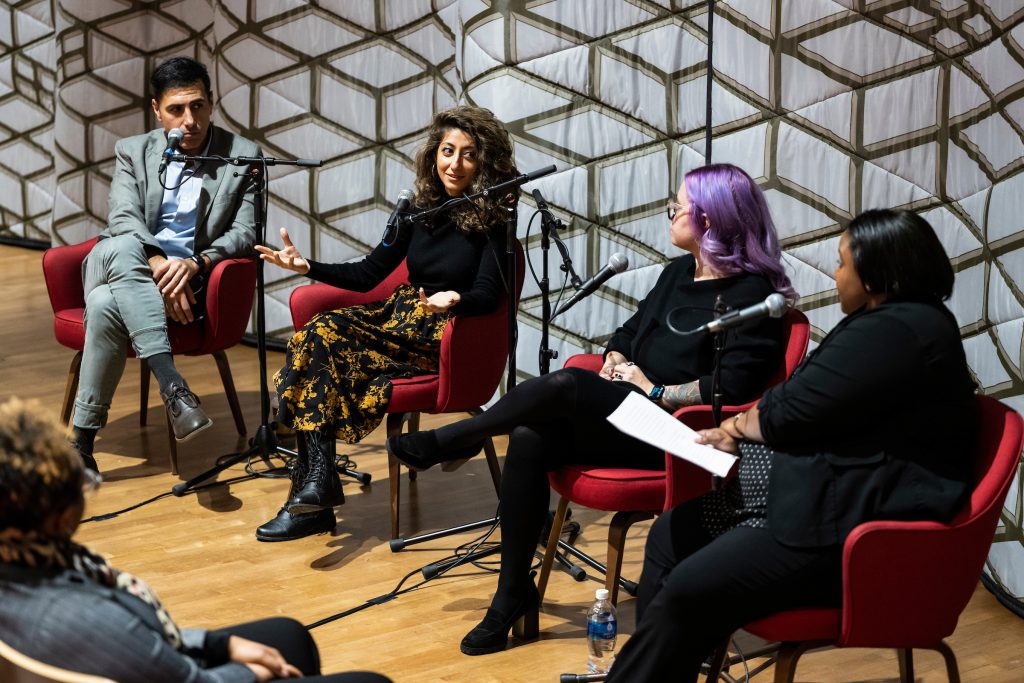 From left to right, Ramtin Arablouei and Rund Abdelfatah (speaking), co-hosts and co-producers of NPR’s podcast “Throughline” and UW–Madison’s fall Journalists in Residence, and Kacie Lucchini Butcher, director of UW–Madison’s Public History Project, engage in a public panel discussion moderated by Christy Clark-Pujara (at far right), a professor of history in UW–Madison’s Department of Afro-American Studies, during a Diversity Forum event held at the Chazen Museum of Art at the University of Wisconsin–Madison on Nov. 14, 2022. The museum is currently hosting the the public exhibit: Sifting & Reckoning: UW–Madison’s History of Exclusion and Resistance. (Photo by Jeff Miller / UW-Madison)