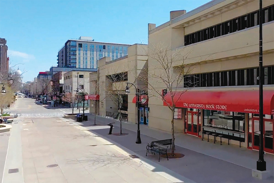 The exterior of University Book Store, located at the base of State Street. The state capitol building can be seen in the distance, at the top of State Street.