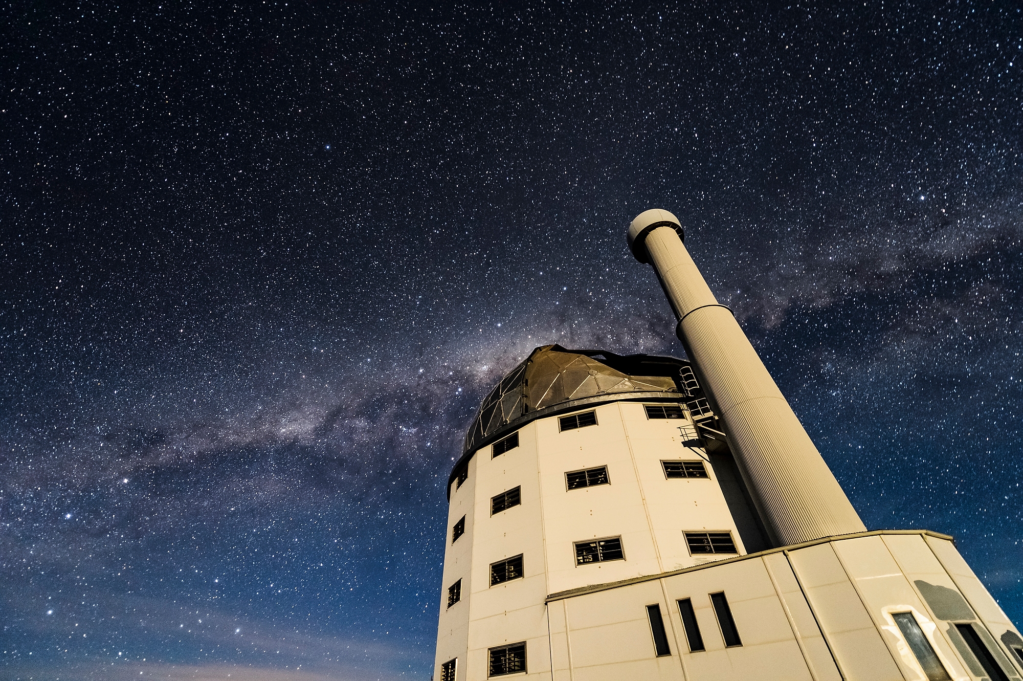 Constellations in night sky behind SALT telescope.