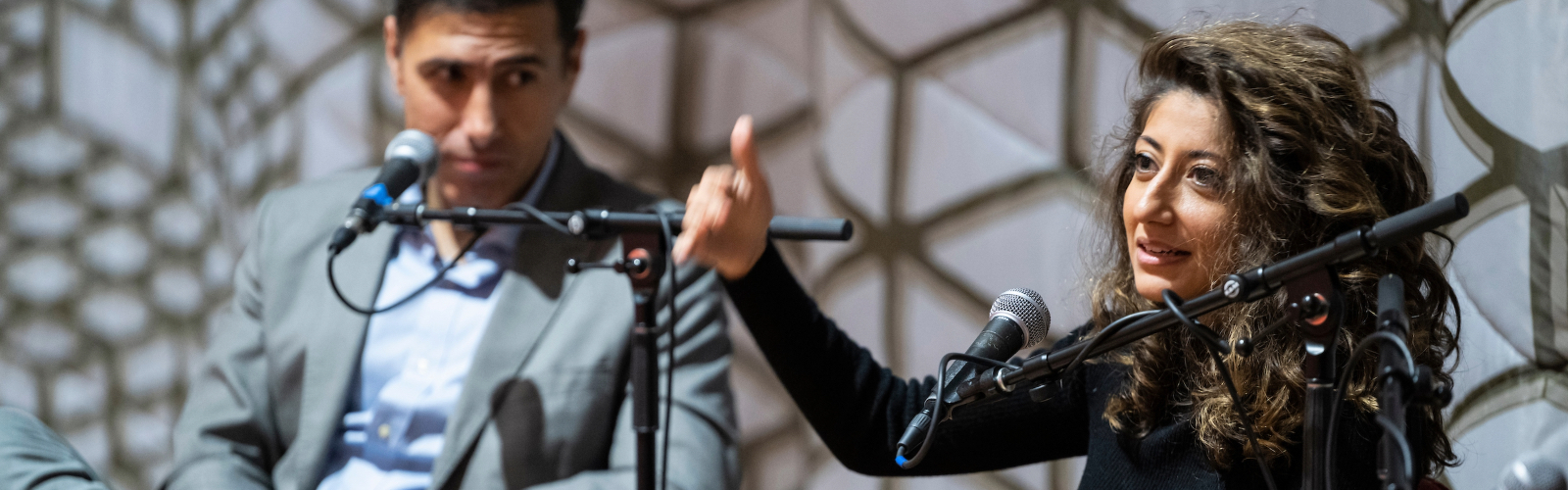Ramtin Arablouei (left) and Rund Abdelfatah, co-hosts and co-producers of NPR’s podcast “Throughline” and UW–Madison’s fall Journalists in Residence engage in a public panel discussion.